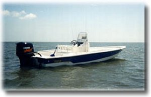 Photo of Back Bay Guide Service Shallow Sport saltwater fishing boat, with Mariner Outboard motor, used for fishing in the Port O'Connor area.